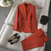 Blazer en broek set oranje met zwarte schoenen en tas
