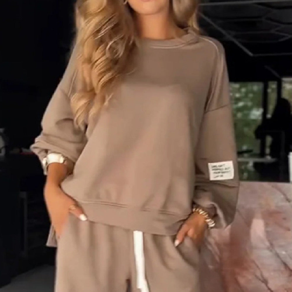 Beige sweatshirt with pocket detail and white drawstring side view