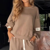 Beige sweatshirt with pocket detail and white drawstring side view