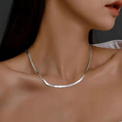 Silver herringbone necklace side view on model