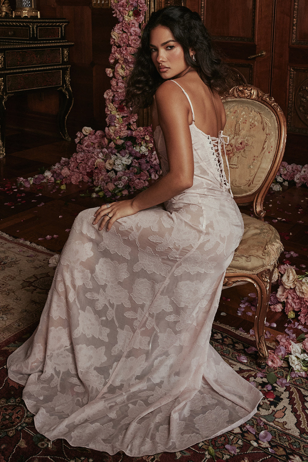 Pink lace maxi dress seated back view