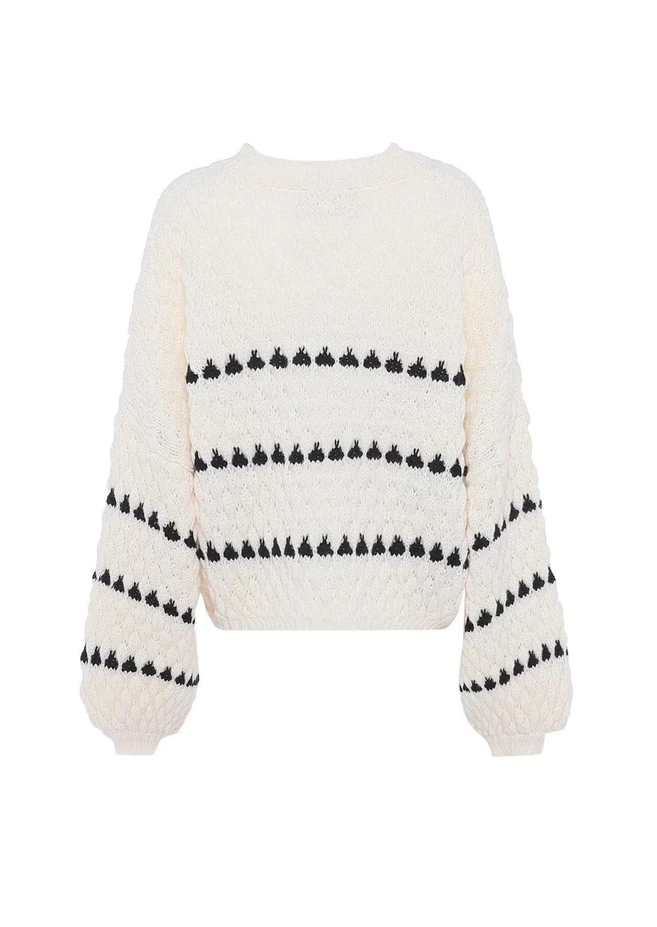 Cream chunky knit sweater with black heart pattern, front view on mannequin, slightly different angle