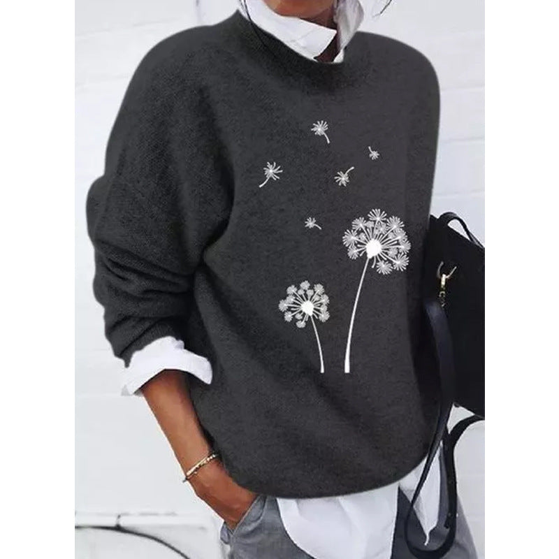 Black sweater with dandelion print front view