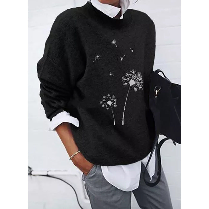 Black sweater with dandelion print side view