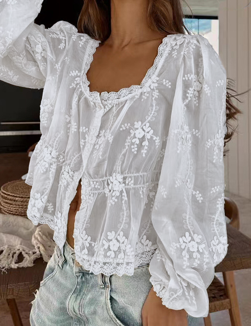 White blouse with floral embroidery front view