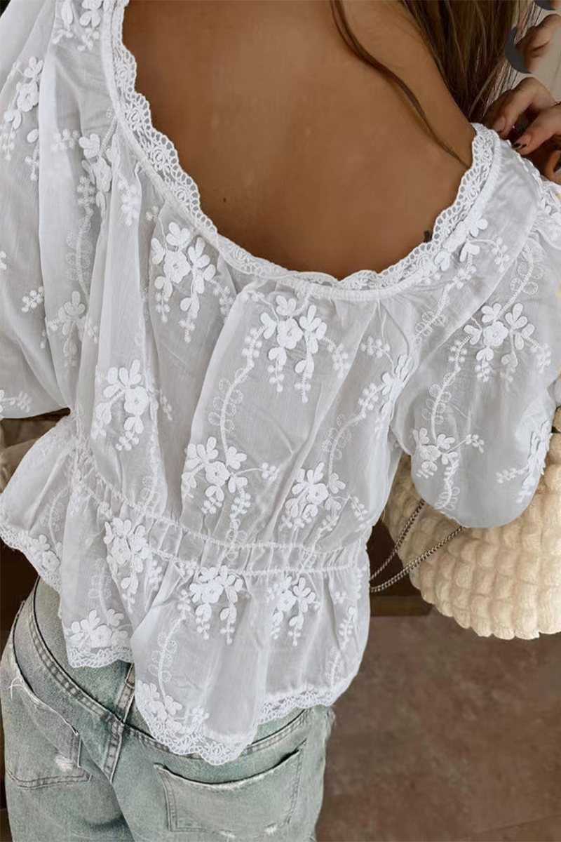White blouse with floral embroidery back view