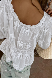 White blouse with floral embroidery back view