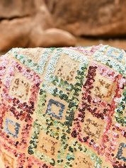Close-up of sequin pattern on mini skirt