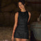 Black sleeveless dress with buttons front view