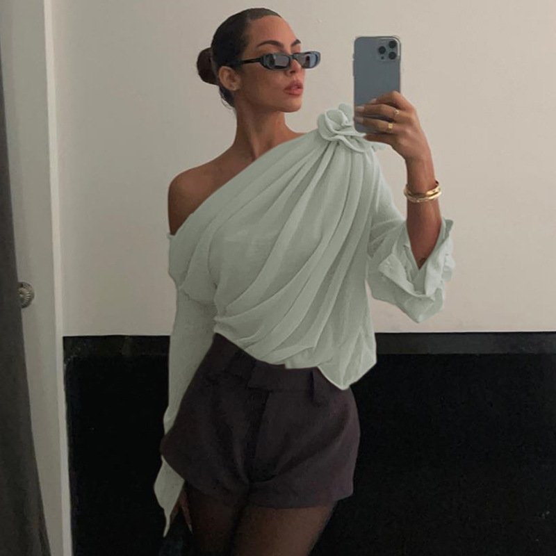 Blouse with draped fabric and floral detail, mirror selfie