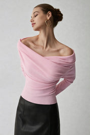 Pink off-shoulder sweater with draped neckline, side view