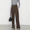 Brown wide-leg trousers with gold belt buckle front view
