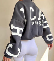 Oversized sweater donkerblauw met witte print rugzijde