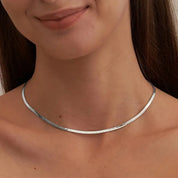 Silver herringbone necklace front view on model