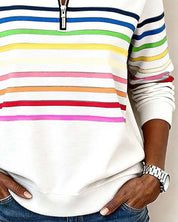 White sweatshirt with colorful stripes close-up waist view