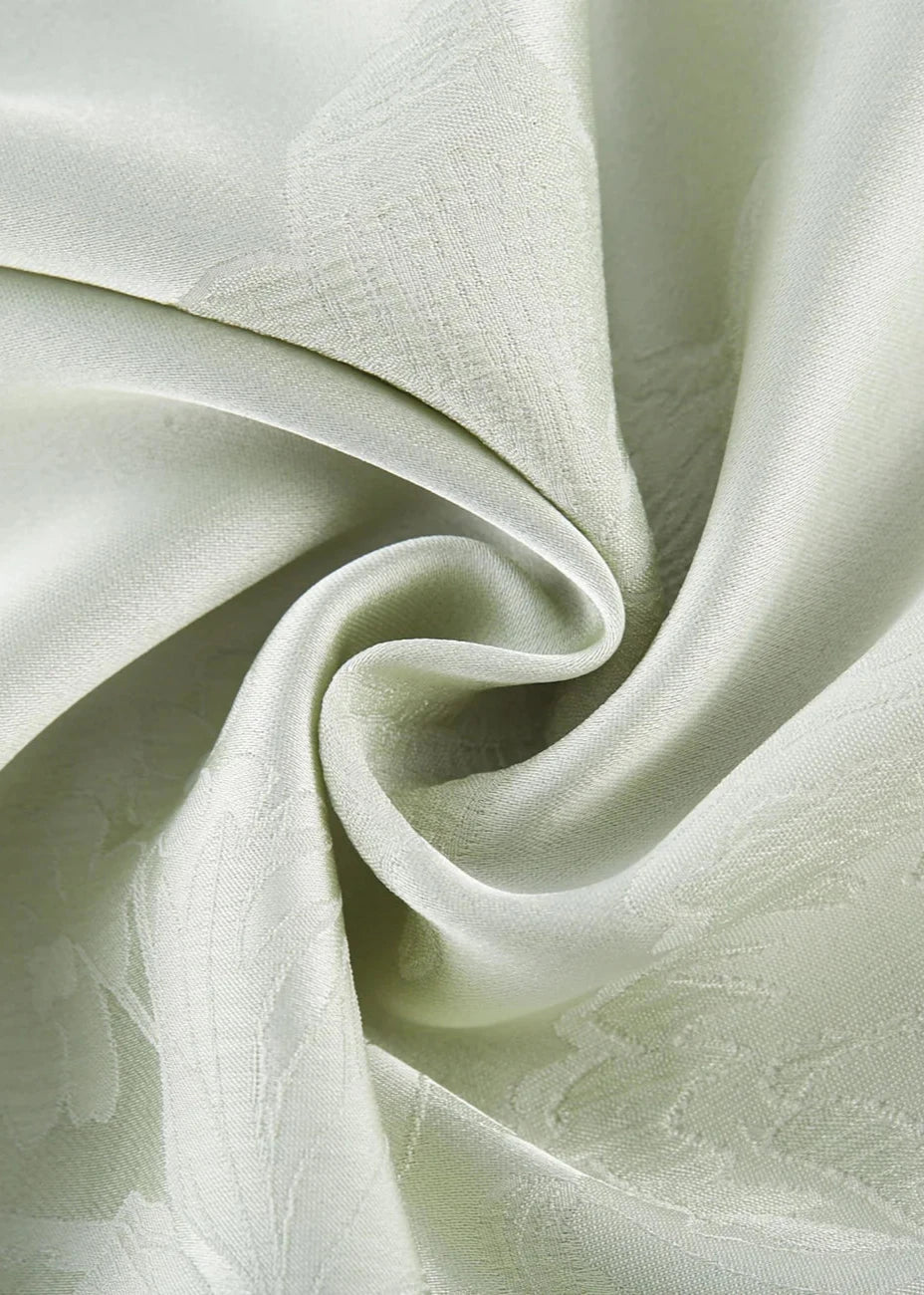 Maxi-jurk pistache groen met bloemenprint detailopname