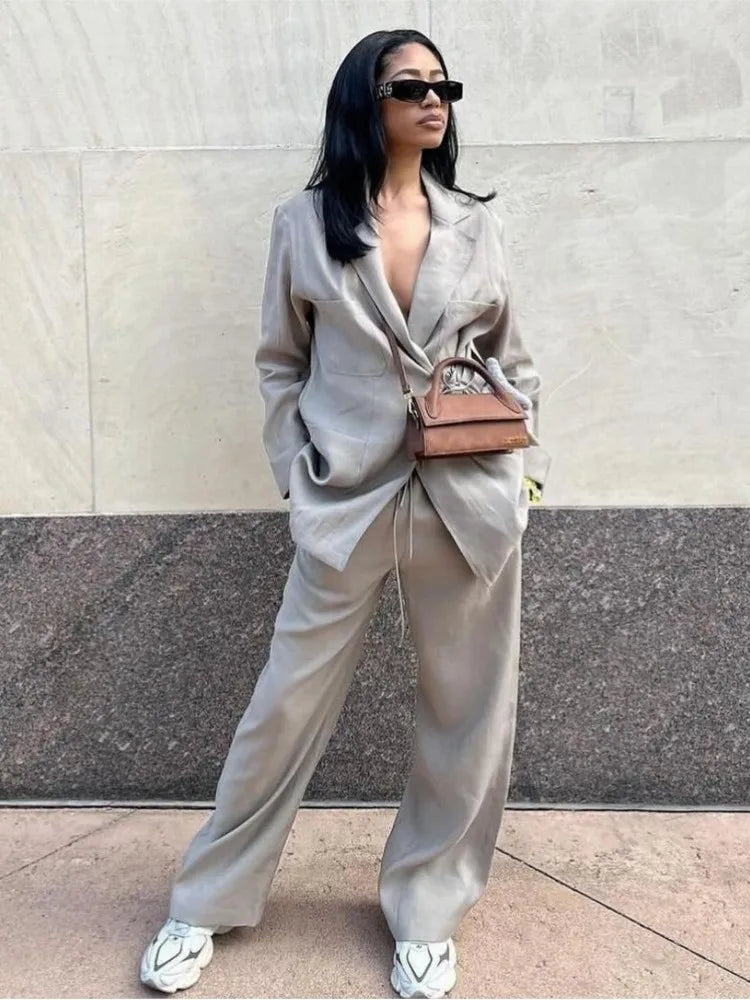 Tweed suit beige front view with white heels and brown bag