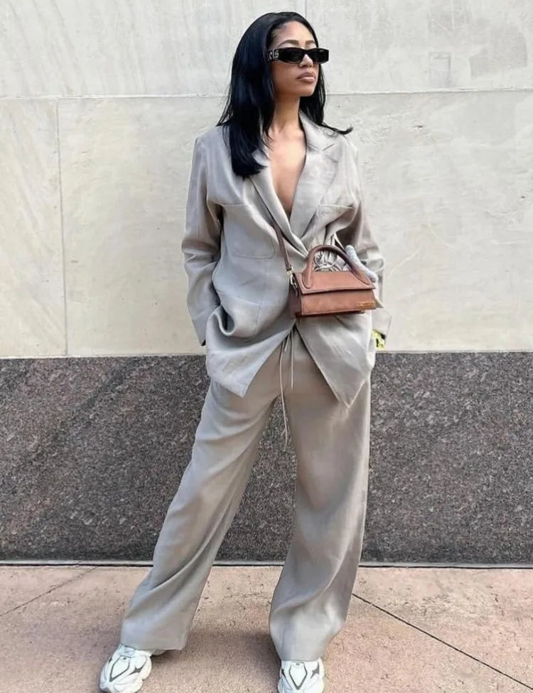 Tweed suit beige front view with white heels and brown bag