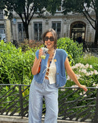 Blue chunky knit vest with gold buttons front view