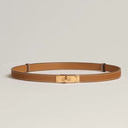 Tan leather belt with gold buckle flat lay