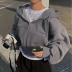 Gray zip-up hoodie with hood worn side view
