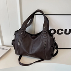 Amber Compacte schoudertas met verstelbare band en stijlvol silhouet
