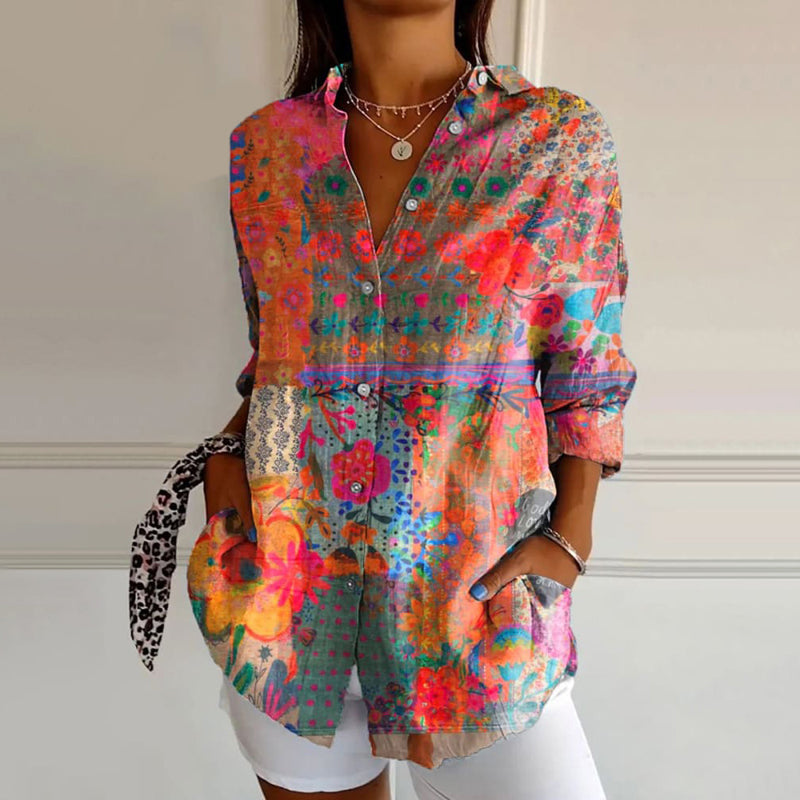 Women's blouse with vibrant floral print, front view