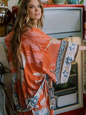 Maxi kimono dames oranje met bloemenprint rugzijde