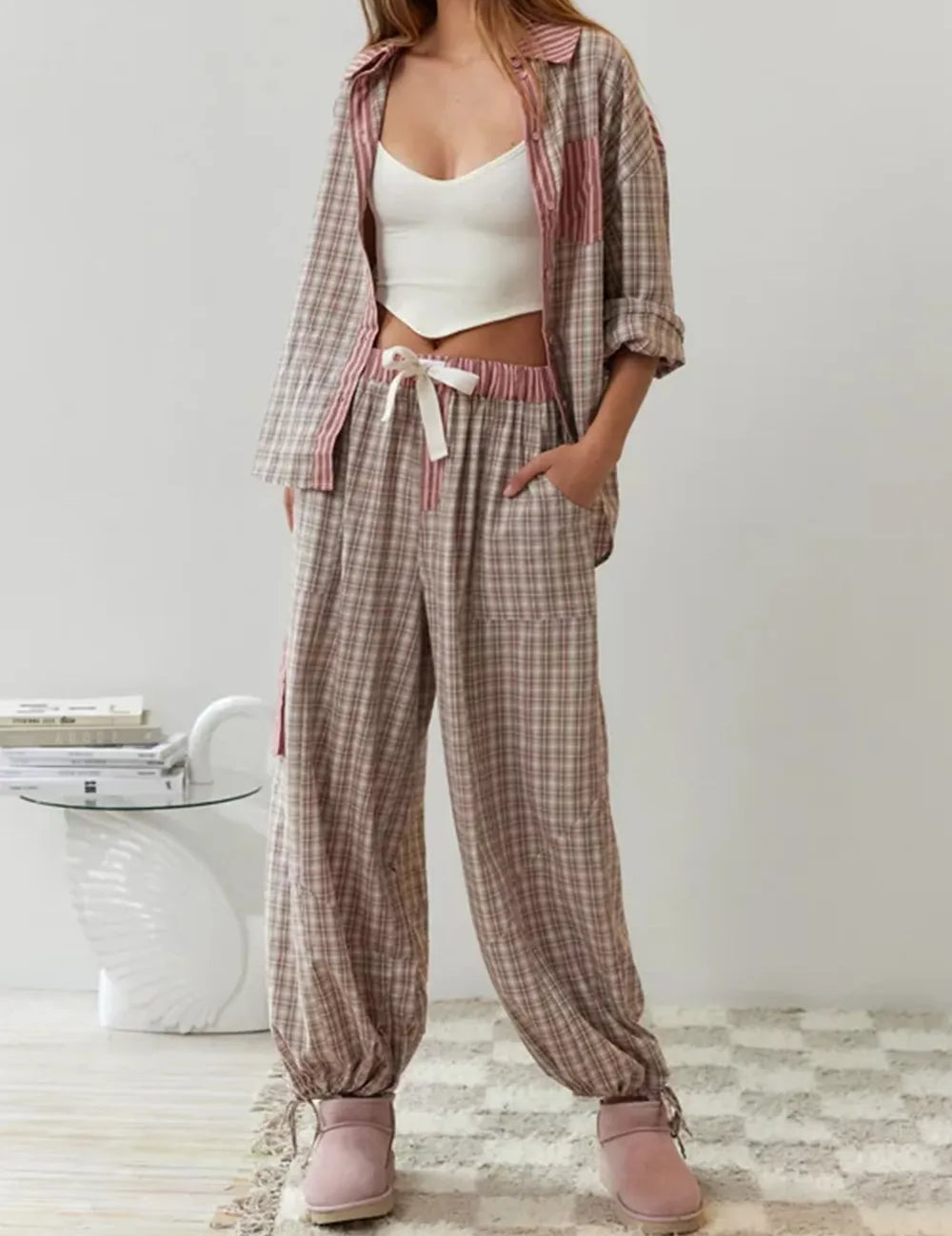 Pyjama set pink and brown checkered with striped accents front view on model