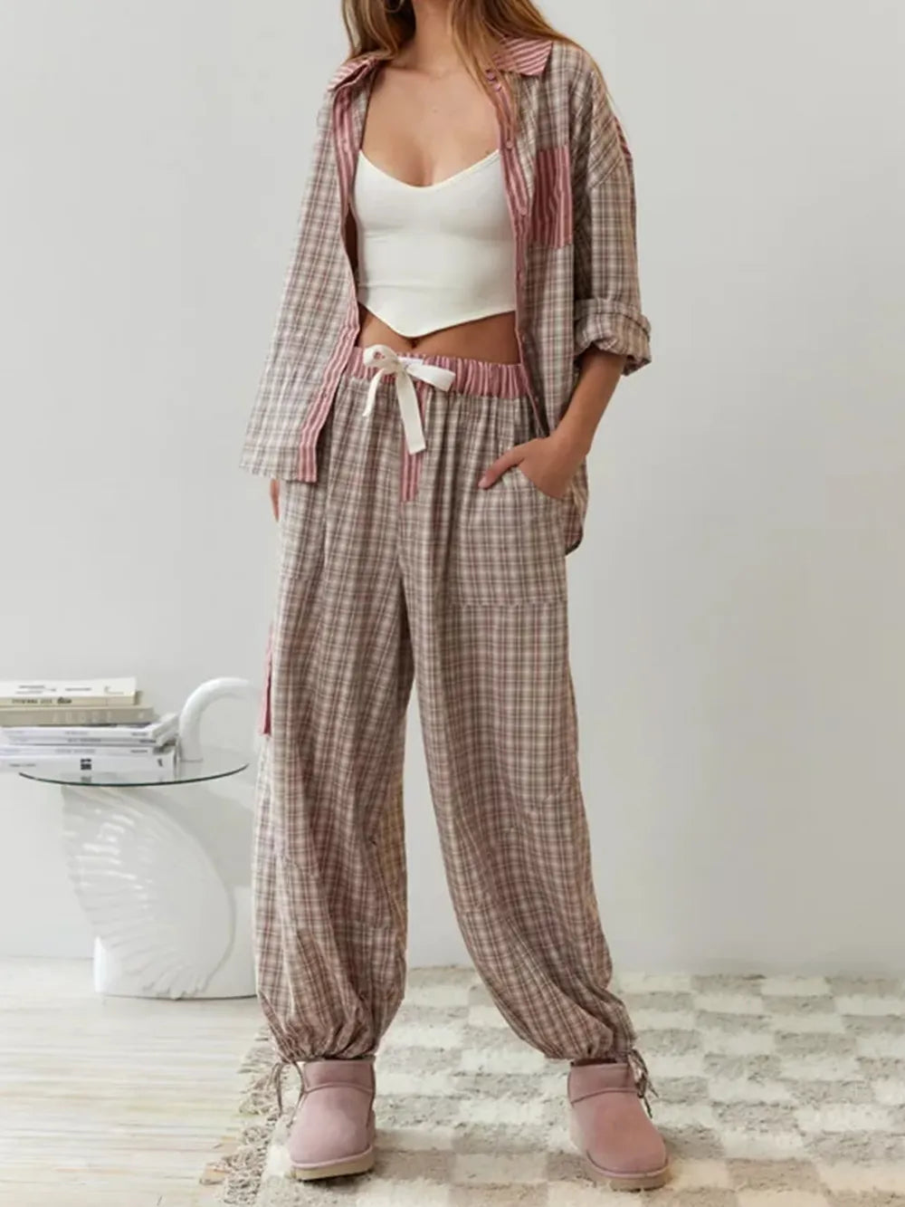 Pyjama set pink and brown checkered with striped accents front view on model