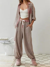 Pyjama set pink and brown checkered with striped accents front view on model