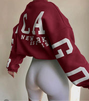 Oversized sweater rood met witte letters en cijfers, rugzijde