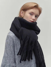 Black scarf with fringe wrapped around neck front view