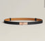 Black leather belt with gold buckle flat lay