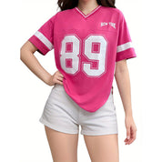 Pink v-neck t-shirt with '89' and 'New York' graphic, front view