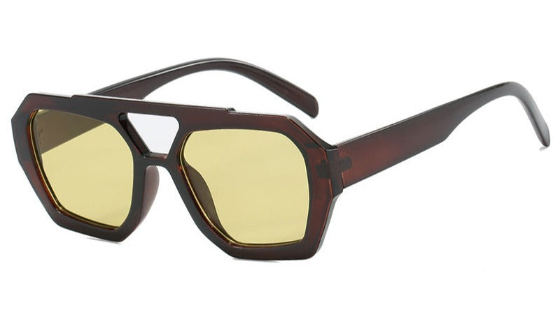 Geometric sunglasses black-brown with yellow lenses front view isolated