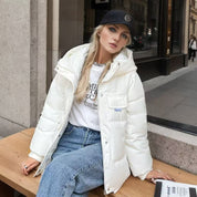 Puffer jacket white with hood seated pose