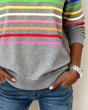 Gray sweatshirt with colorful stripes close-up waist view