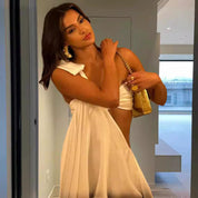 White asymmetrical draped dress side view