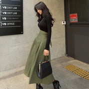 High-waisted skirt with bow detail olive green front view