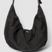 Schoudertas zwart puffer stof detail shot