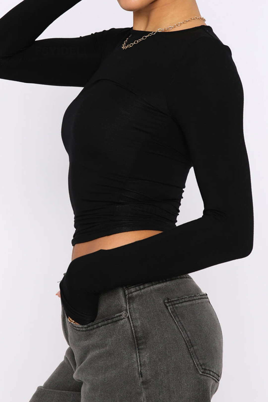 Black long-sleeve crop top front view on model