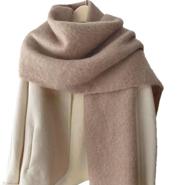 Beige scarf with fringe wrapped around neck front view