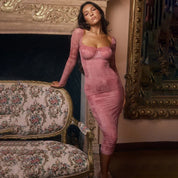 Pink lace midi dress front view with ornate background