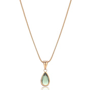 Gold necklace with teardrop-shaped green stone pendant, front view