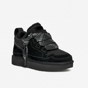 Black suede sneakers with shearling lining front view