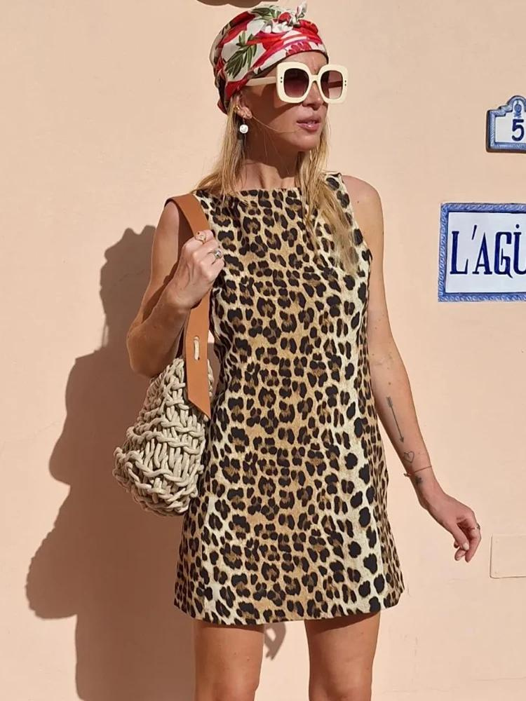 Leopard print dress sleeveless front view with headscarf