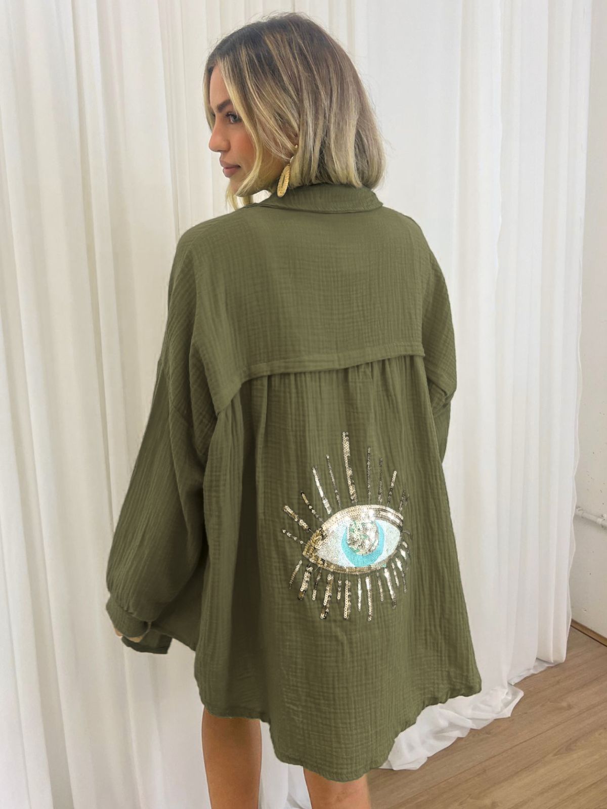 Oversized shirt with sequin eye detail, olive green, front view