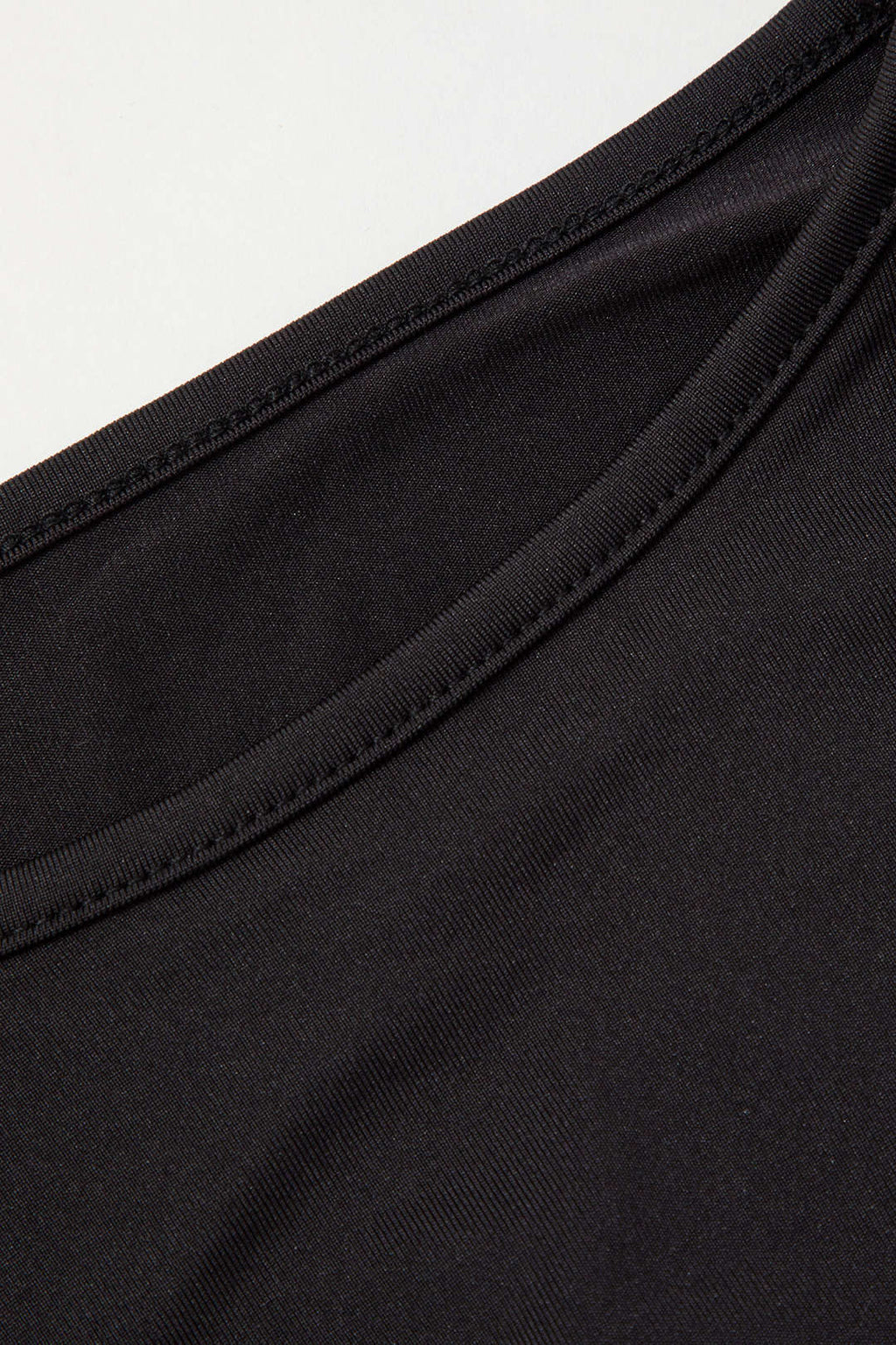 Black long-sleeve crop top hem detail