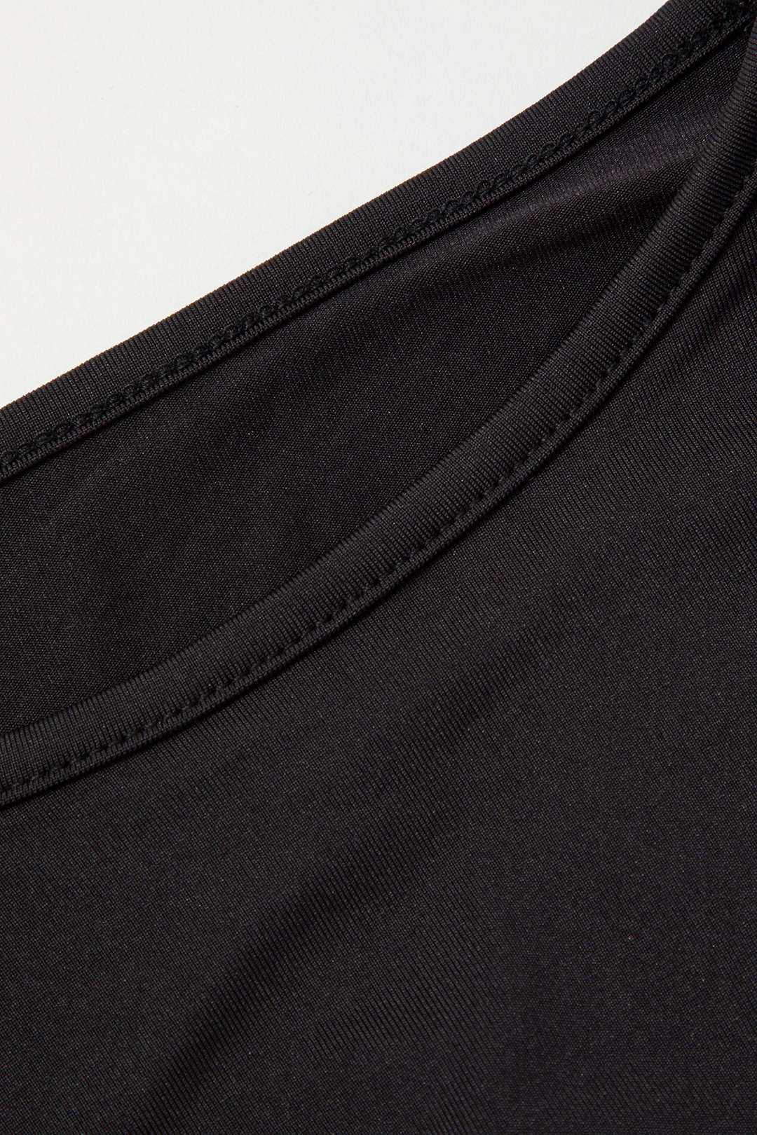 Black long-sleeve crop top hem detail